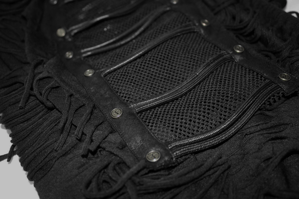Close-up of a black gothic t-shirt featuring fringes, mesh details, and decorative studs for a trendy style.