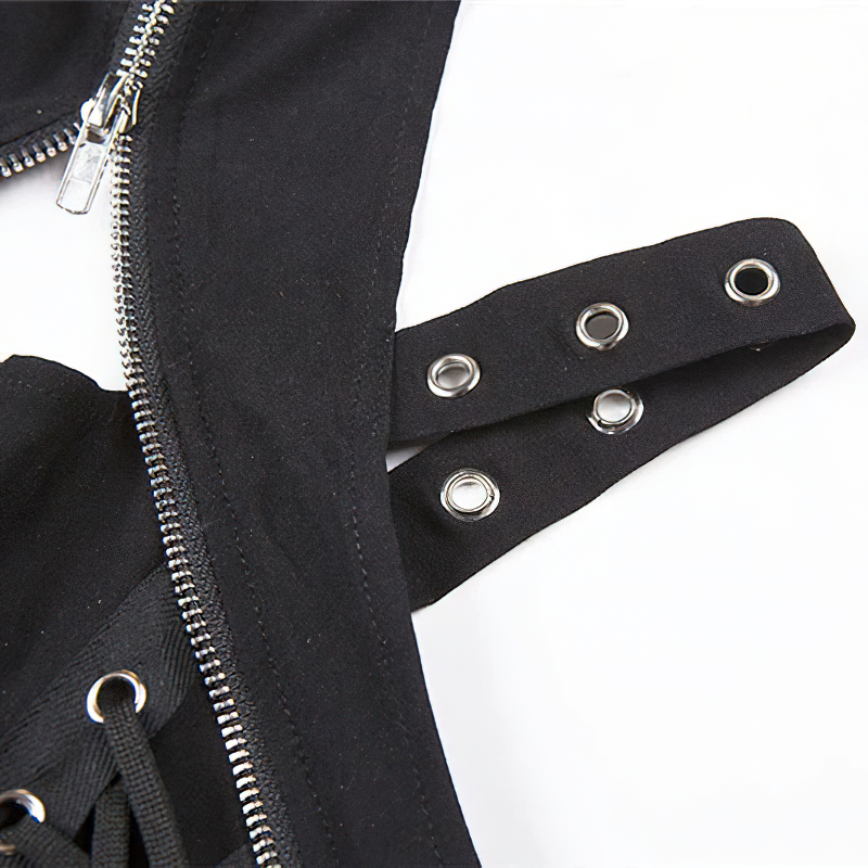 Close-up of a black gothic tank top showcasing silver rivets and stylish zip detail for a trendy look.