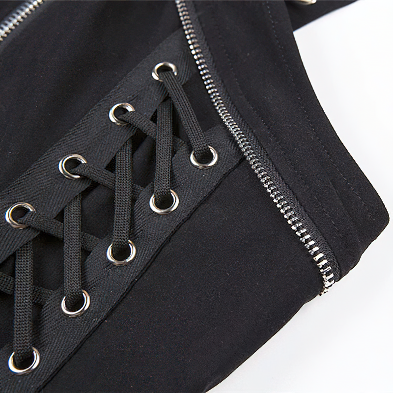 Close-up of trendy black gothic tank top featuring stylish lace-up detail and silver rivets for a fashionable look.
