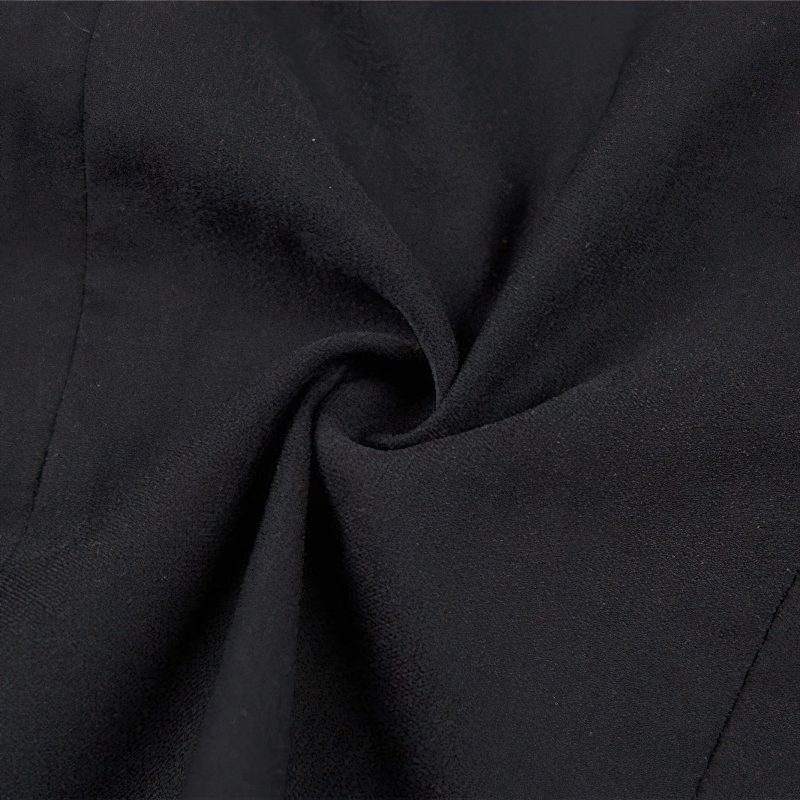 Close-up of soft black fabric showcasing the texture of a gothic crop top for women.