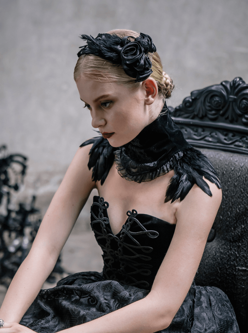 Model wearing a black velvet lace choker with feathers, showcasing gothic style in elegant attire.