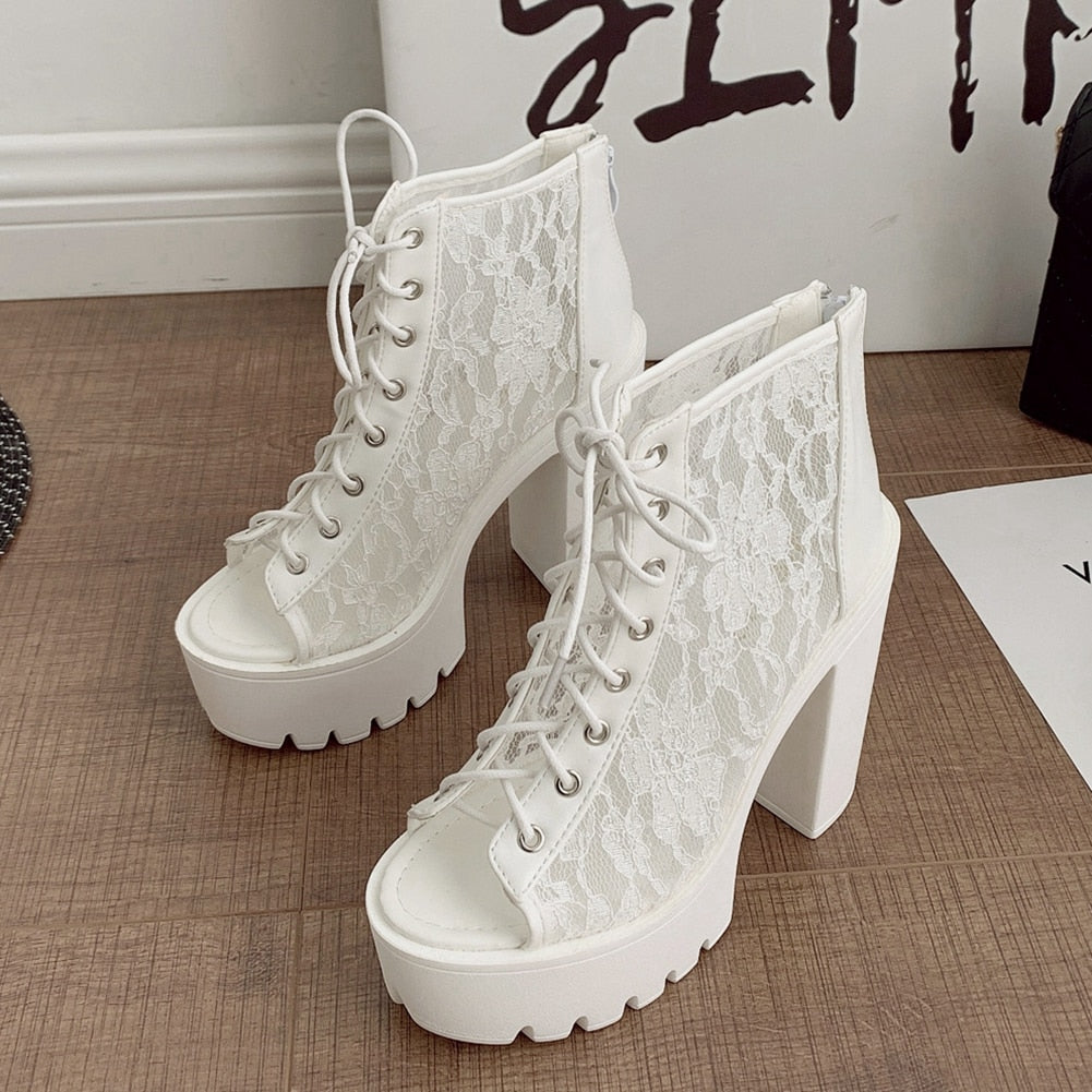 Gothic white lace heeled sandals with thick platform and open toe, stylish alternative fashion footwear.
