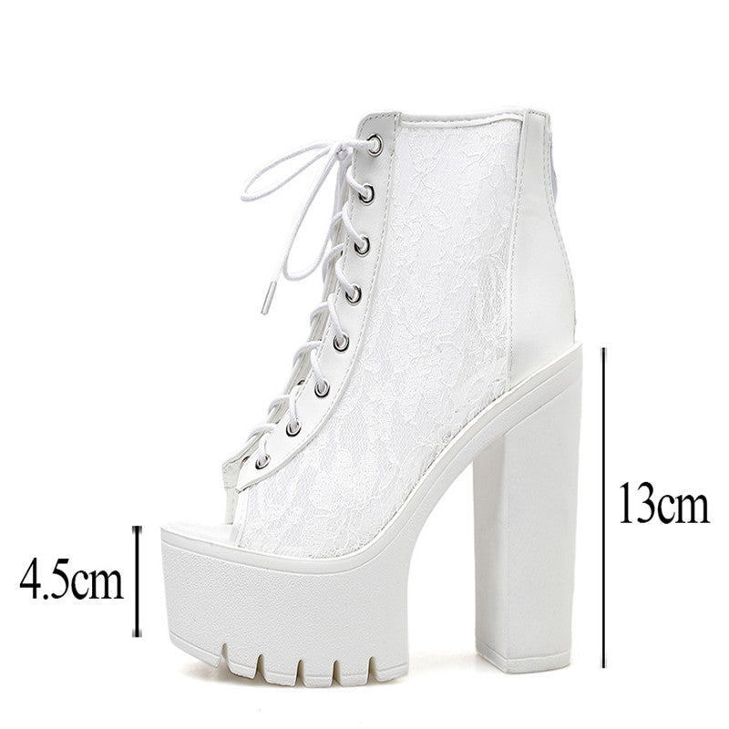 Gothic white high platform sandals with thick square heels and lace design, perfect for alternative rock style outfits.