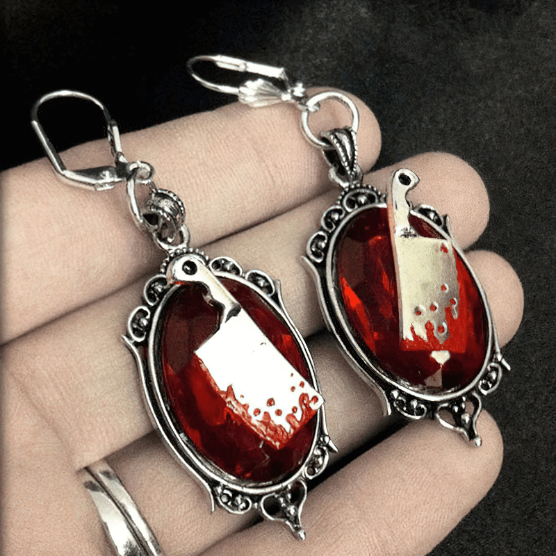 Gothic bloody meat cleaver earrings with red stone, perfect for adding flair to your fashion jewelry collection.
