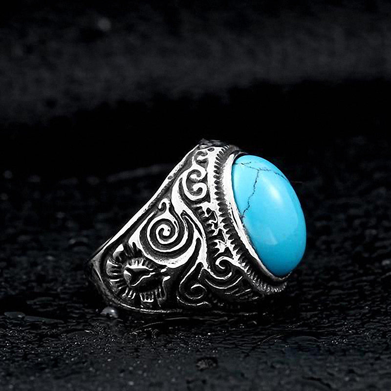 Gothic blue and black stone ring in stainless steel, featuring intricate designs and a vibrant turquoise stone.