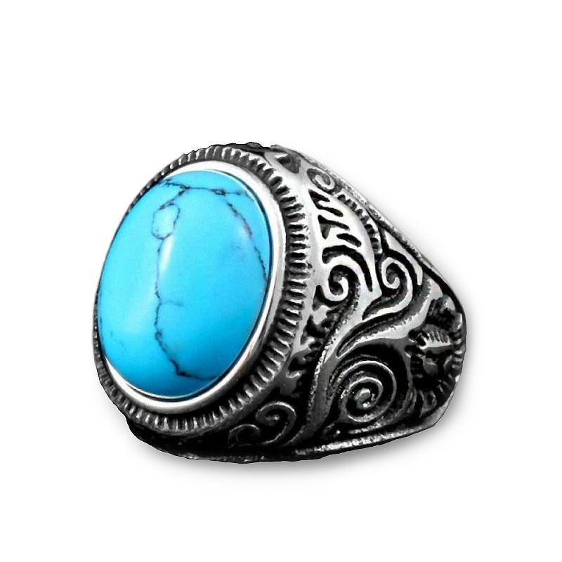 Gothic blue and black stone ring featuring a large turquoise stone set in intricate stainless steel band.