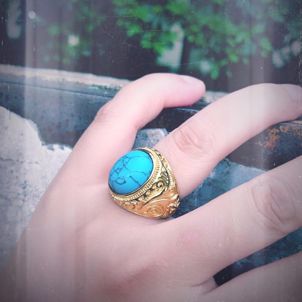 Gothic blue and black stone ring on a hand, showcasing stainless steel and unique design for unisex fashion jewelry.