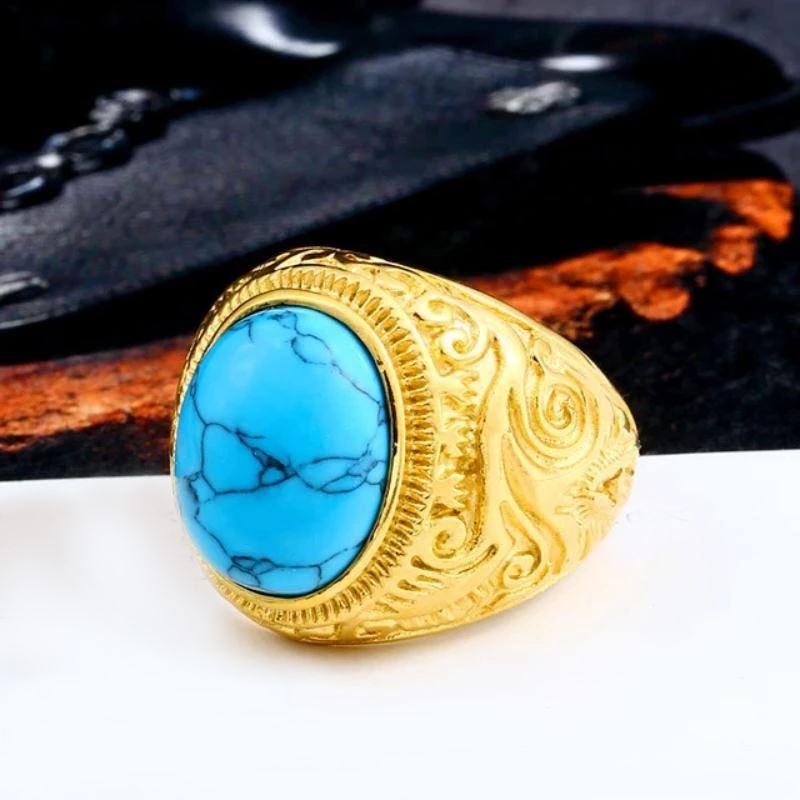 Gothic blue stone ring with ornate gold design, alternative fashion jewelry perfect for gifts and personal collections.