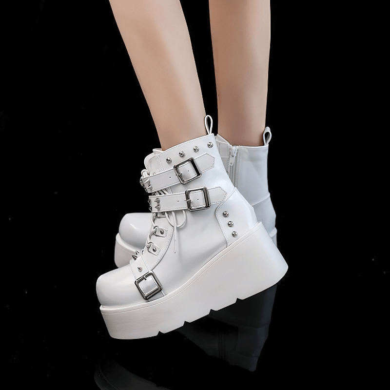 Stylish white platform ankle boots with spikes and rivets, perfect for punk fashion. Ideal for edgy women's footwear.
