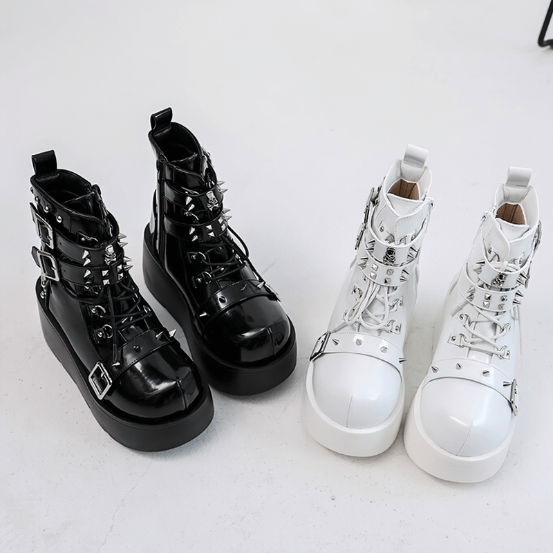 Gothic platform ankle boots in black and white with spikes and rivets, perfect for punk fashion lovers.