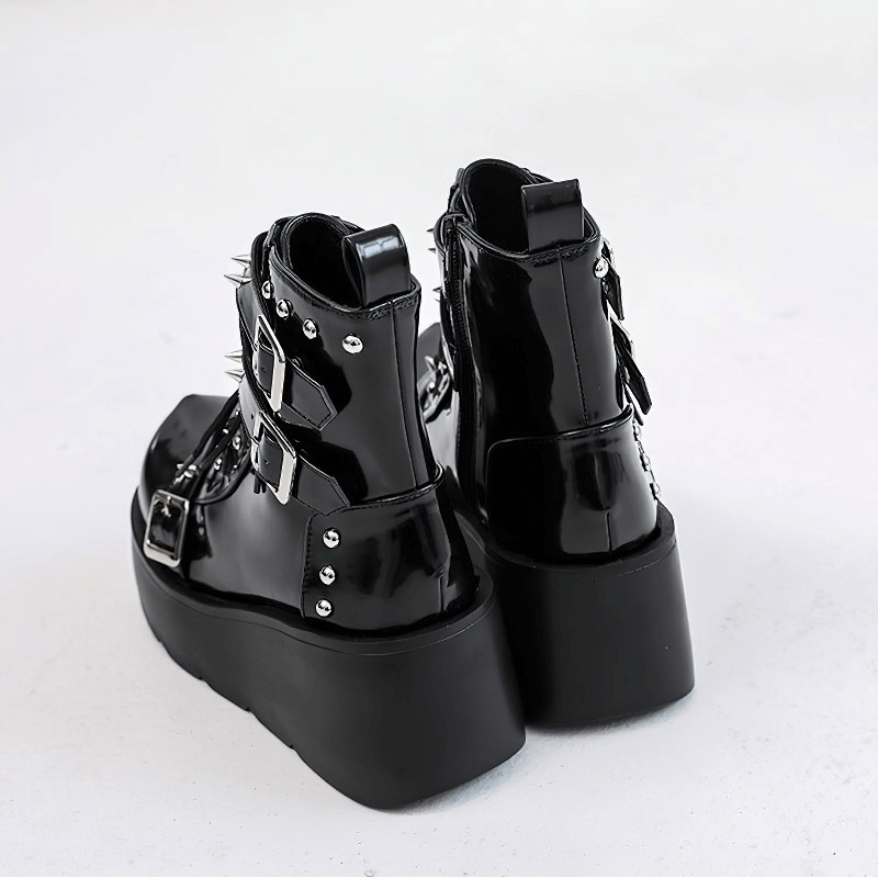 Stylish black gothic platform ankle boots with spikes and rivets, perfect for a punk fashion statement.