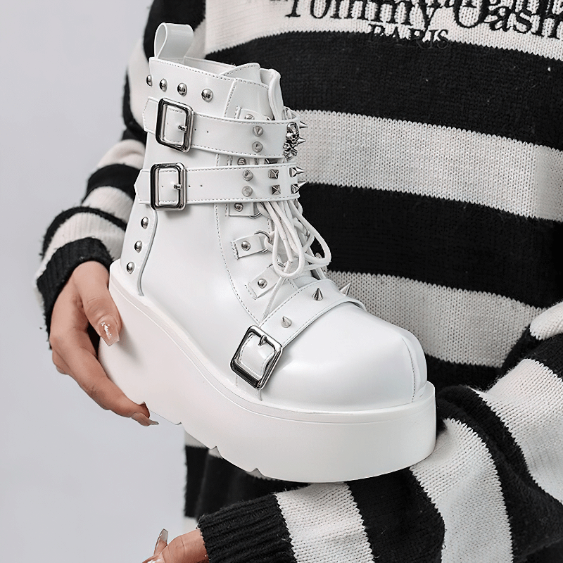Gothic white platform ankle boots with spikes and rivets, perfect for punk fashion lovers.