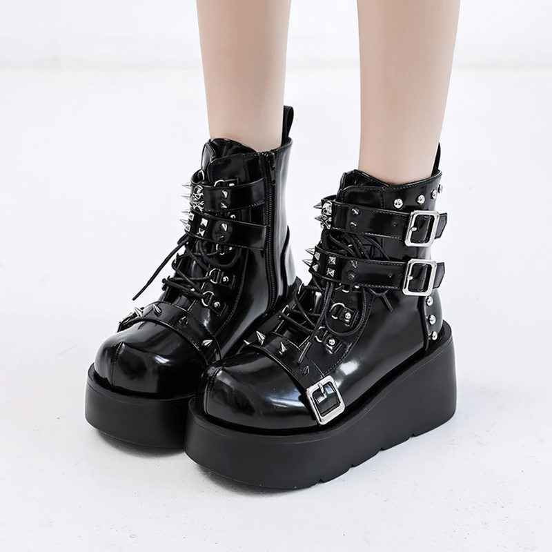 Stylish black gothic platform ankle boots with spikes and buckles, perfect for a punk fashion statement.