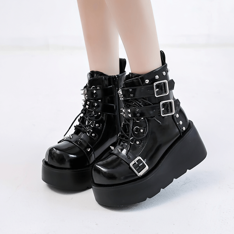 Gothic black platform ankle boots with spikes and buckles, perfect for punk fashion lovers.