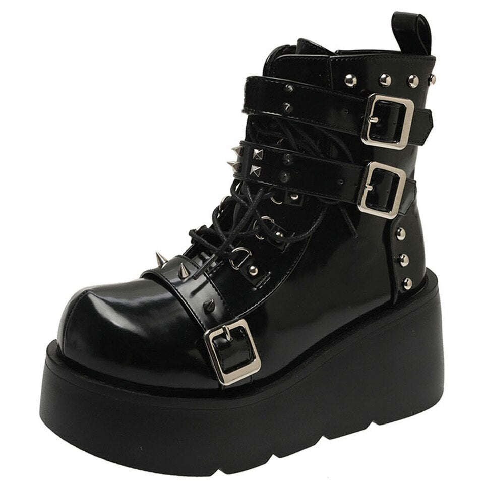 Gothic black platform ankle boots with spikes and rivets, showcasing a punk style perfect for edgy fashion.