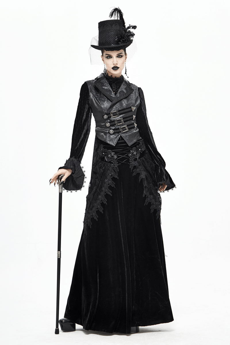 Gothic fashion model in black attire holding a cane with dragon claw and glass ball, showcasing exquisite accessories.