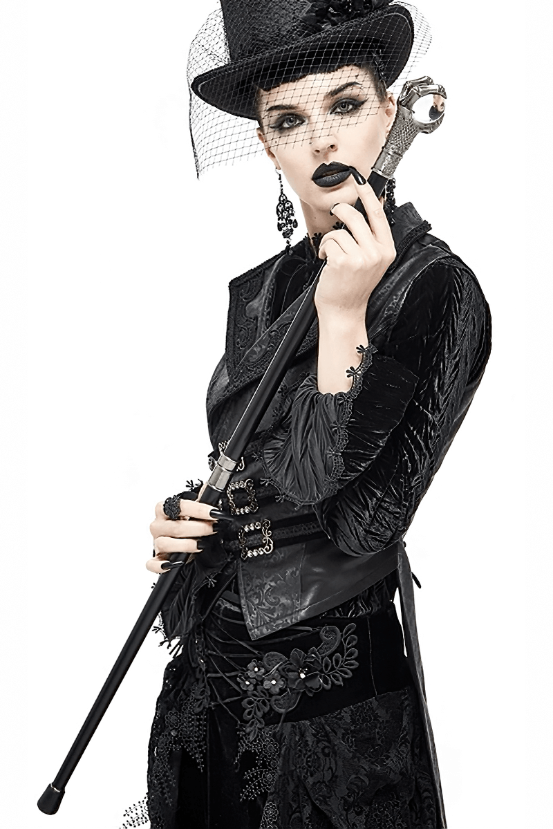 Stylish model in gothic attire holding a unisex dragon claw cane with glass ball, perfect for unique fashion statements.