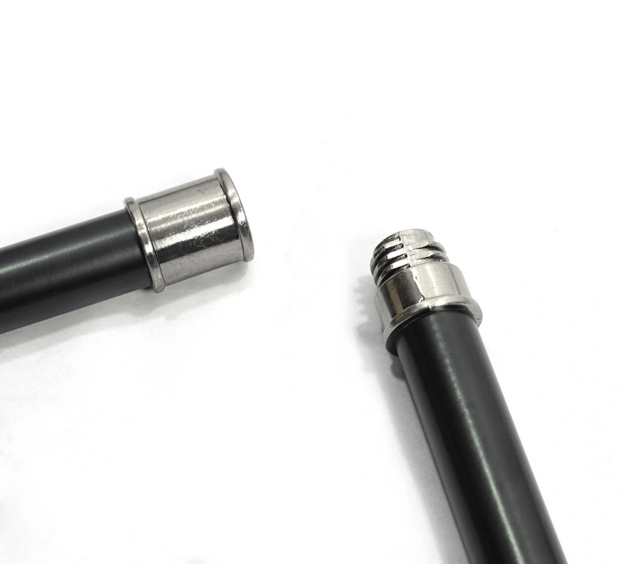 Close-up of a gothic cane with a sleek black handle and silver fittings, showcasing its exquisite design.