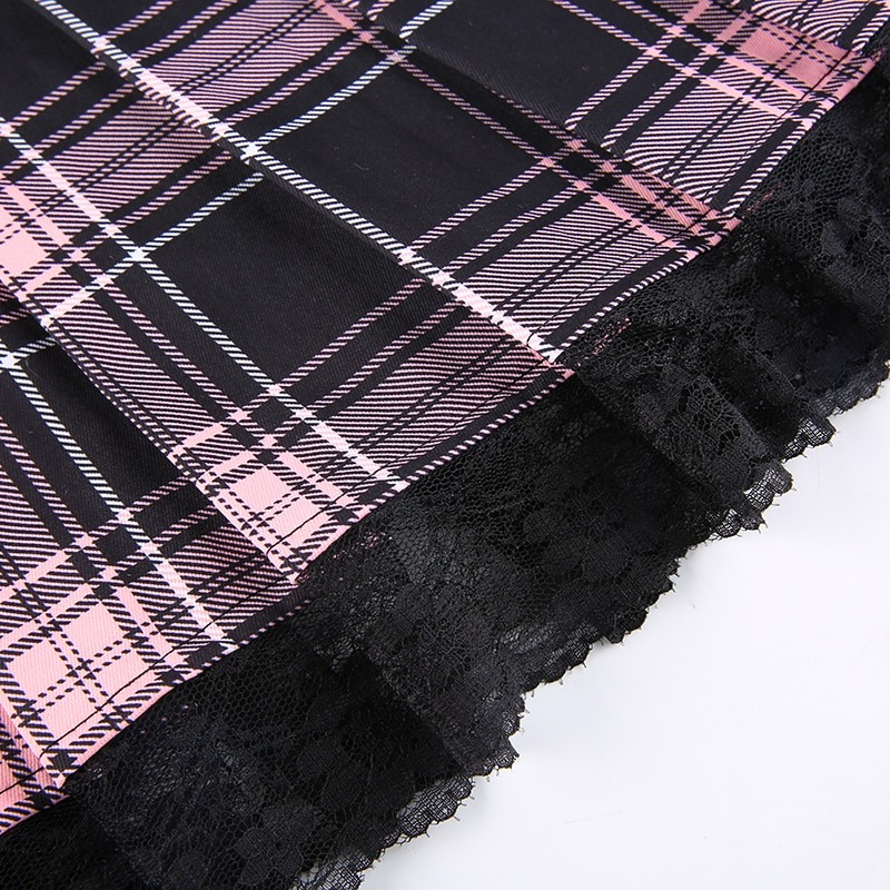 Gothic checkered mini skirt with pink and black plaid pattern and lace trim, perfect for punk fashion aesthetics.
