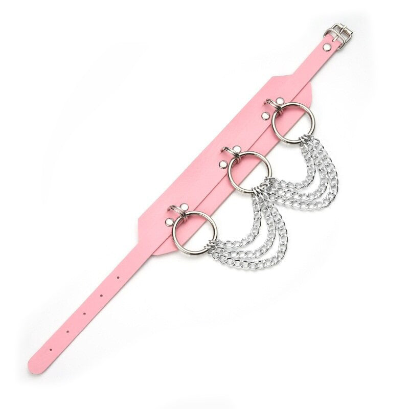 Fashionable pink gothic choker featuring silver chain and ring details, perfect for rock styles and bold fashion statements.