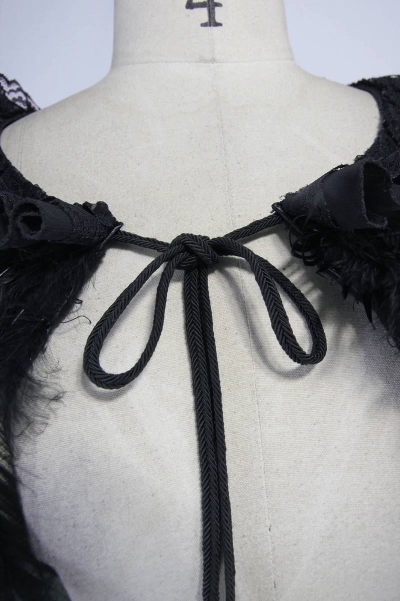 Close-up of gothic crow feather shoulder accessory showcasing the elegant black drawstring tie and intricate detailing.