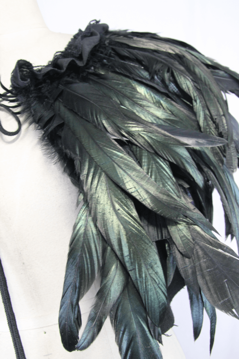 Close-up of a Gothic crow feather shoulder accessory in iridescent black and green hues, perfect for a steampunk look.
