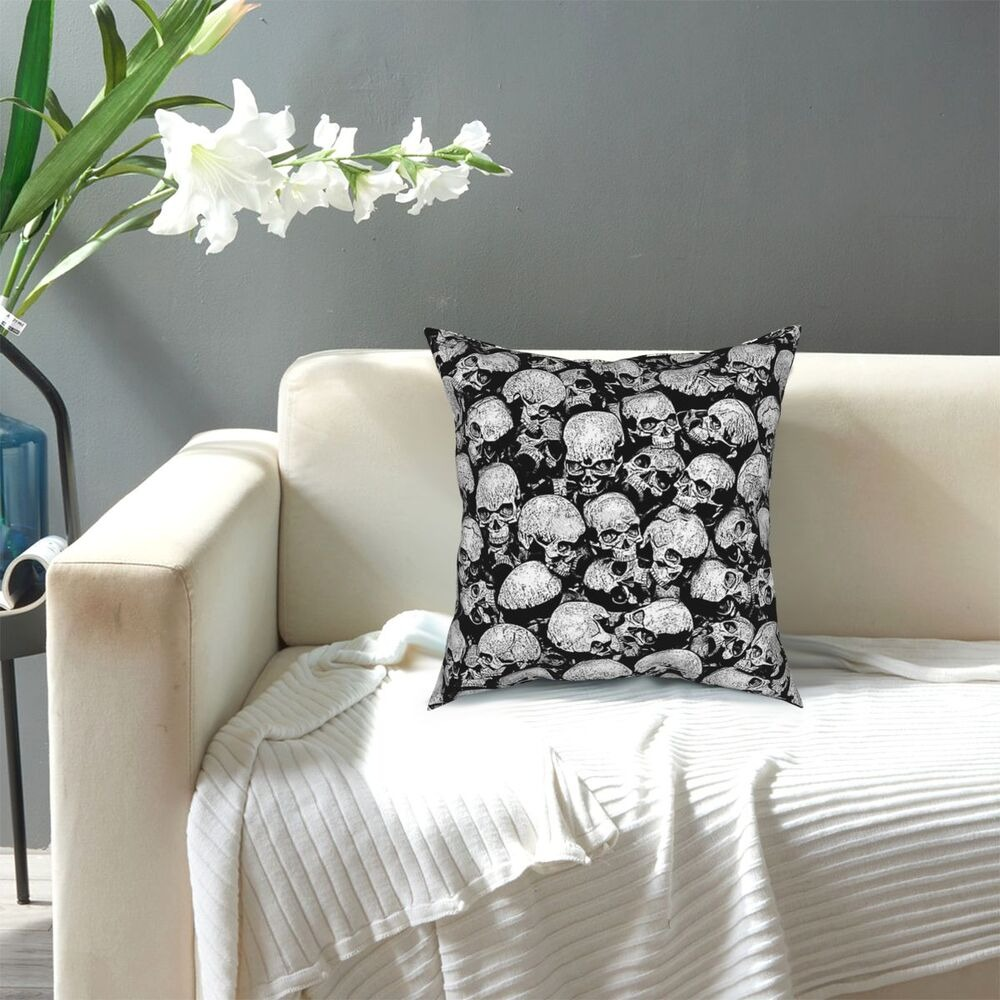 Gothic decorative pillow cover with skull print on a sofa, stylish home decor in black and white.