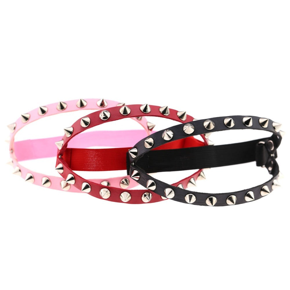 Gothic elastic garter belts in pink, red, and black with spikes for cosplay and fashion accessories.