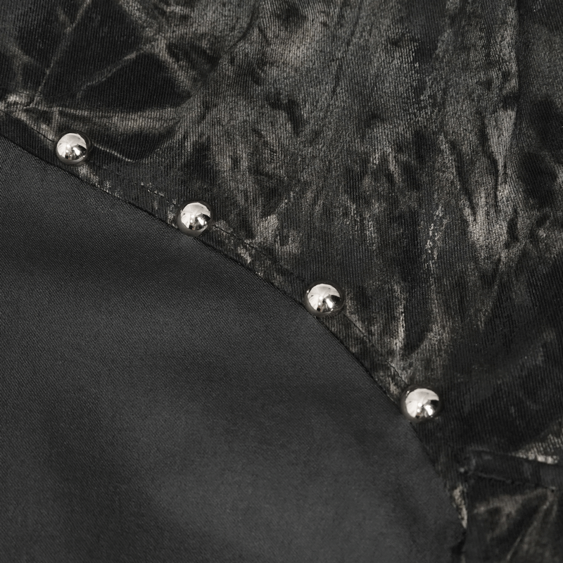 Close-up of gothic splice jogger pants featuring punk rivets and textured fabric for a stylish edge.