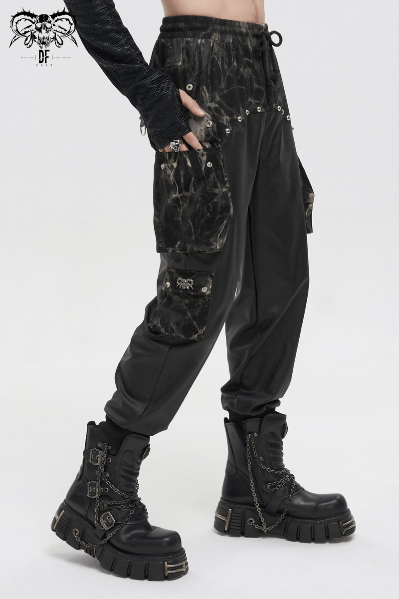 Men's gothic jogger pants with rivets and elastic waistband, paired with chunky black boots.