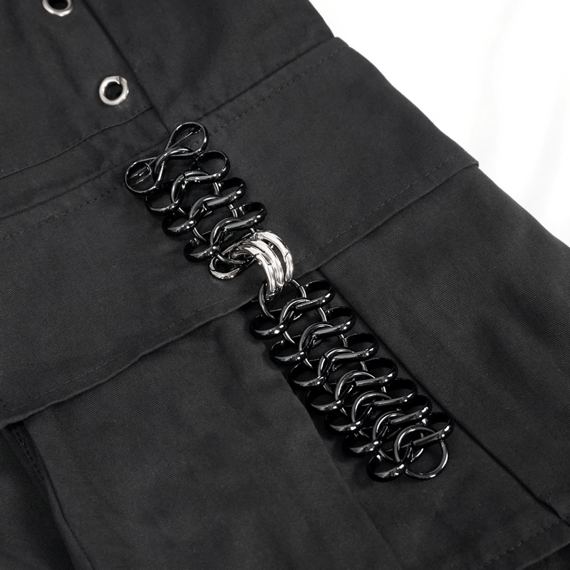Close-up of black cargo pants with trendy hoop and rivet accent detailing for a punk style.