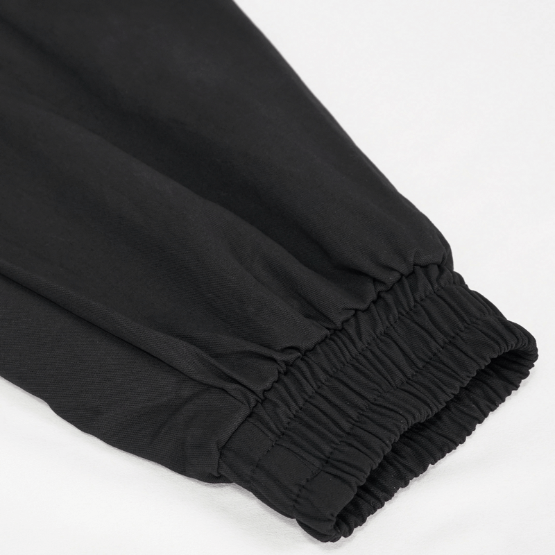 Close-up of Gothic tapered trousers elastic waistband for a punk style look.