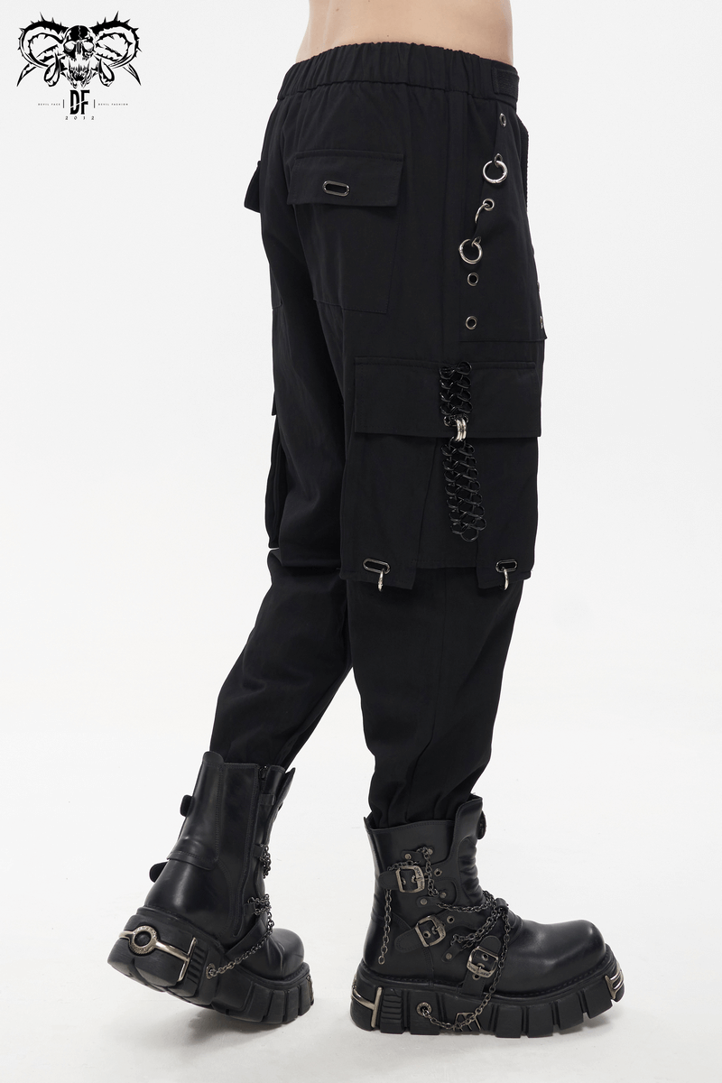 Men's gothic tapered cargo trousers with rivets and hoop accents, styled with chunky black boots.