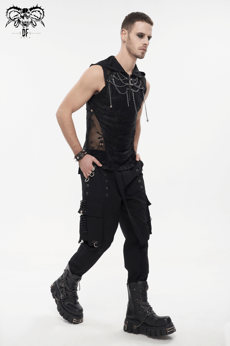 Punk male model wearing black cargo pants with rivets, hoop accents, and a stylish sleeveless top.