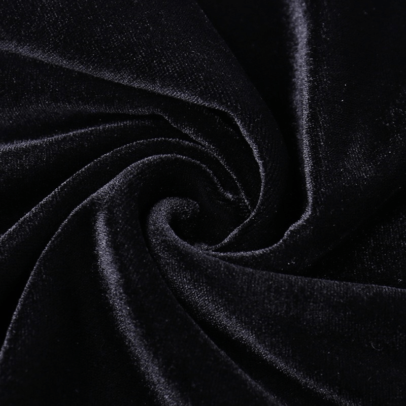 Luxurious black velvet fabric close-up, perfect for elegant gothic fashion and chic dresses.