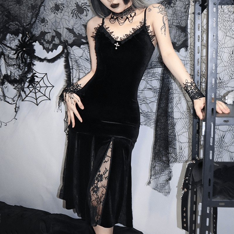 Gothic elegant women in black velvet V-neck midi dress with lace detailing, perfect for grunge style fashion.