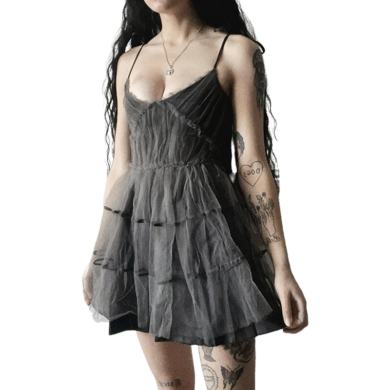 Stylish woman wearing a gothic elegant mesh dress with high waist and vintage patchwork design.