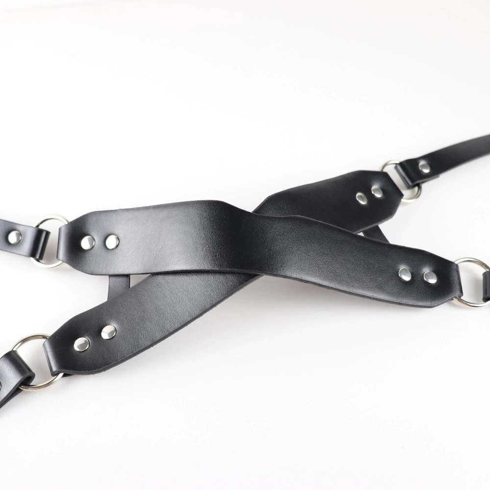 Gothic fashion leather harness with criss-cross design, perfect for edgy cosplay outfits and unique styling.
