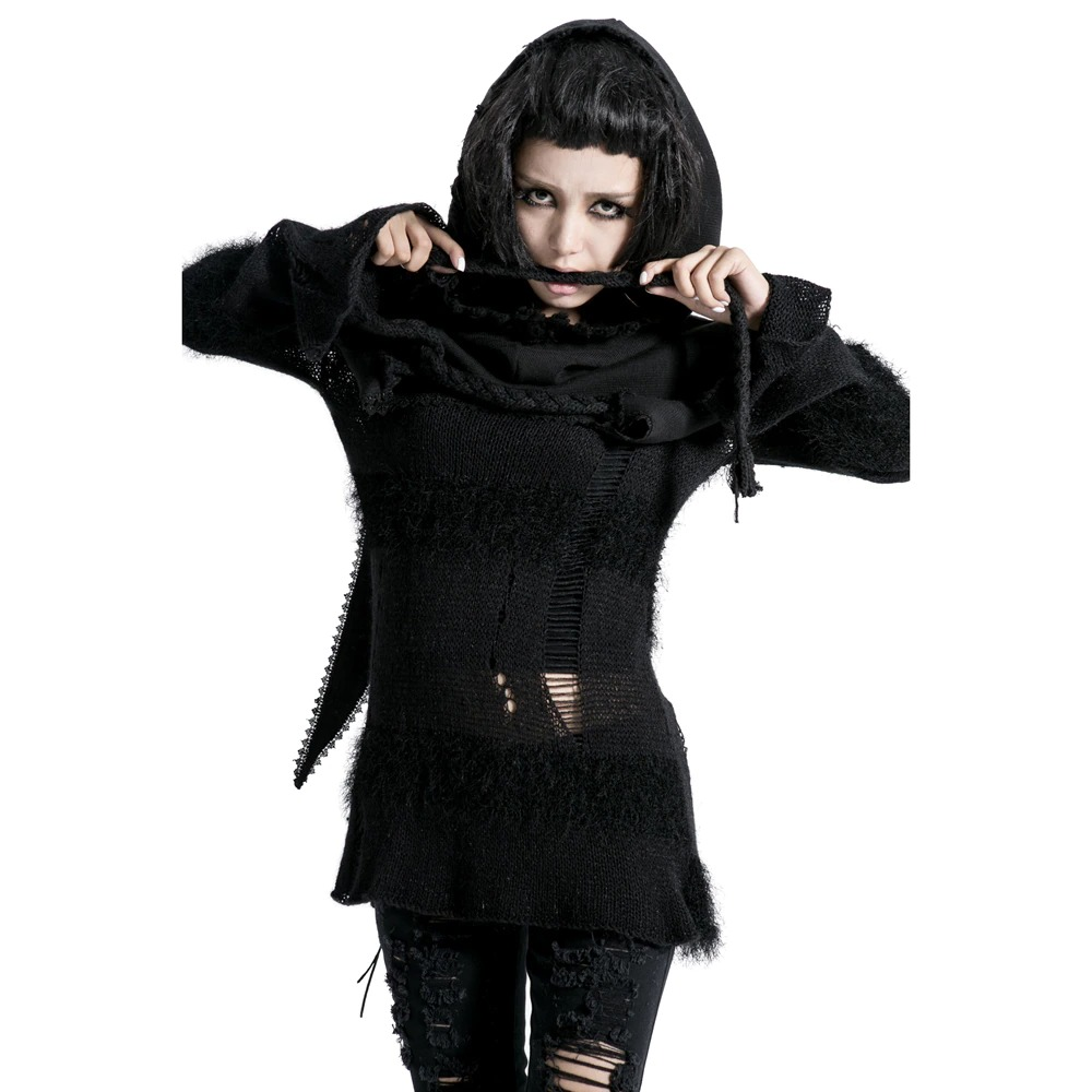 Gothic female model in a black knitted wool cape with hood, showcasing punk style and unique fashion.