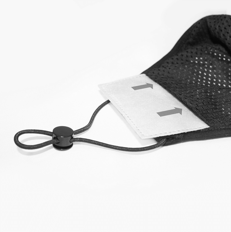 Close-up of adjustable black mesh mask strap with toggle and filter pocket, perfect for protection and style.