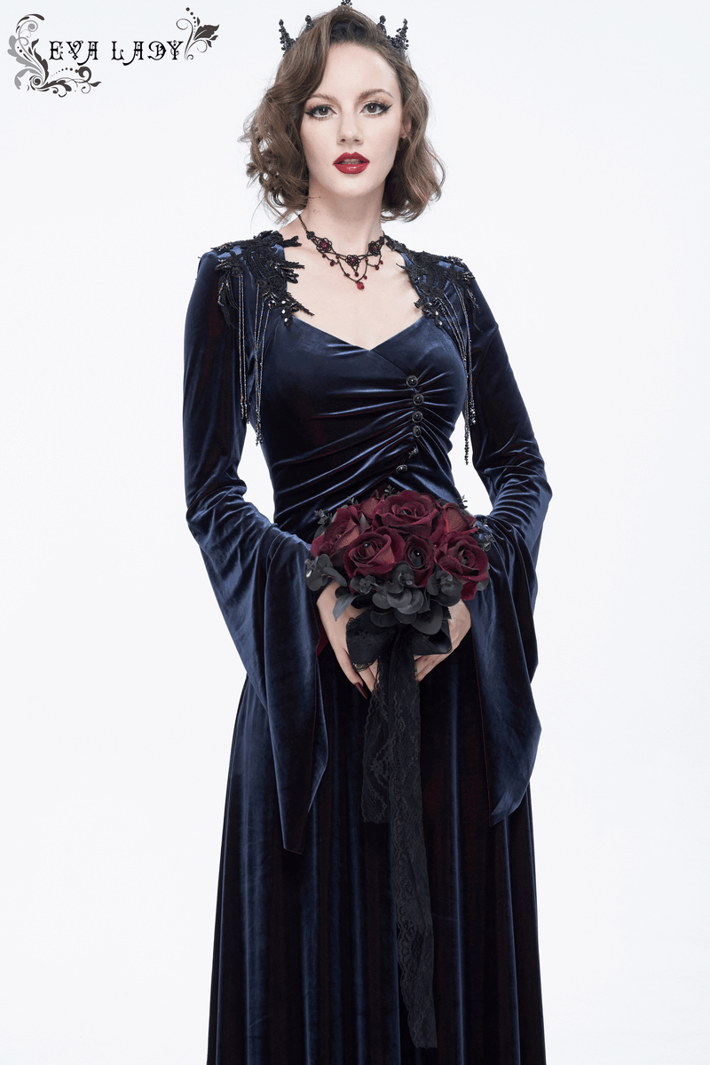 Gothic lady in a blue velvet dress holding a black and red flower bouquet with lace accents, perfect gothic accessory.