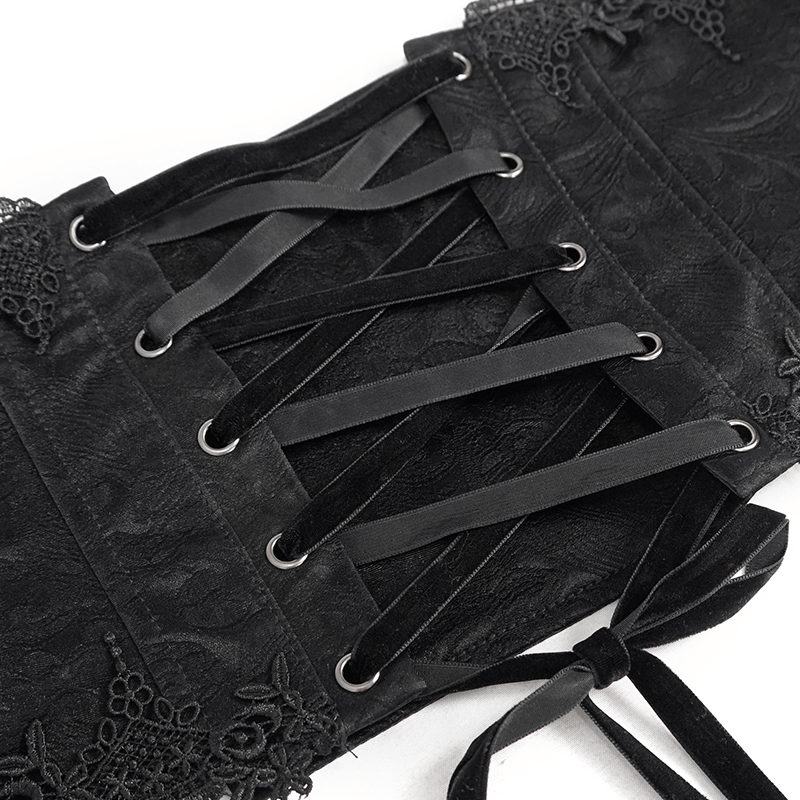 Close-up of a gothic black floral lace corset girdle with back lacing and elegant detailing.