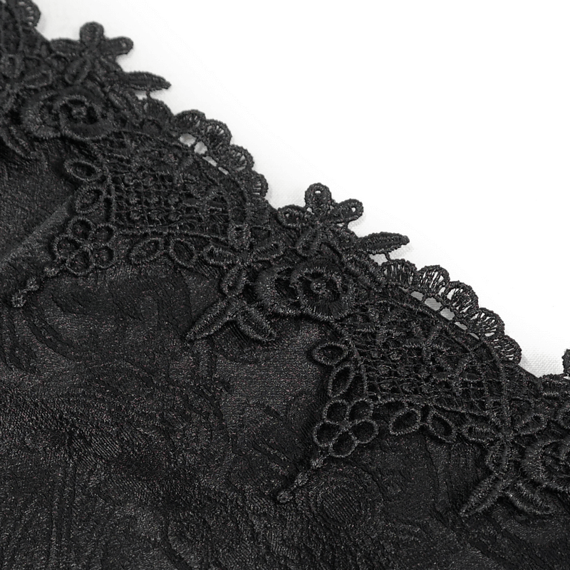 Close-up of intricate black floral lace detail on a gothic corset, showcasing elegant vintage design.