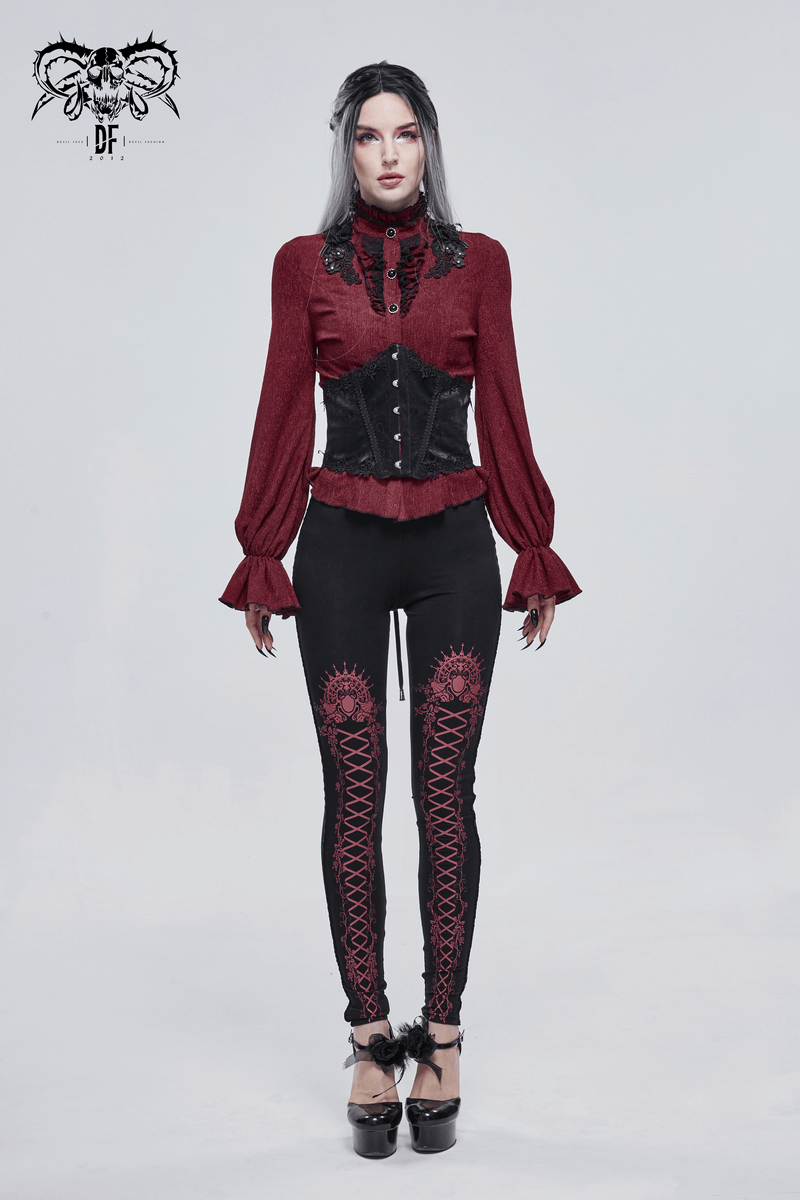 Gothic style model in a red top and black corset, paired with dark leggings featuring floral lace design.