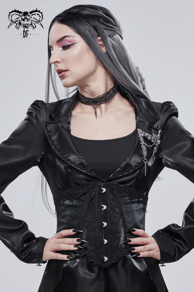 Gothic woman in black satin corset with lace, showcasing elegant style and vintage fashion statement.