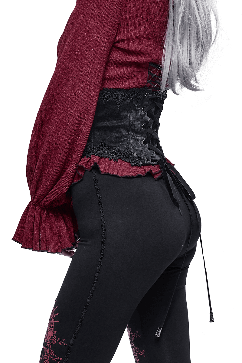 Gothic women's black floral lace corset girdle paired with a stylish red top and black leggings.