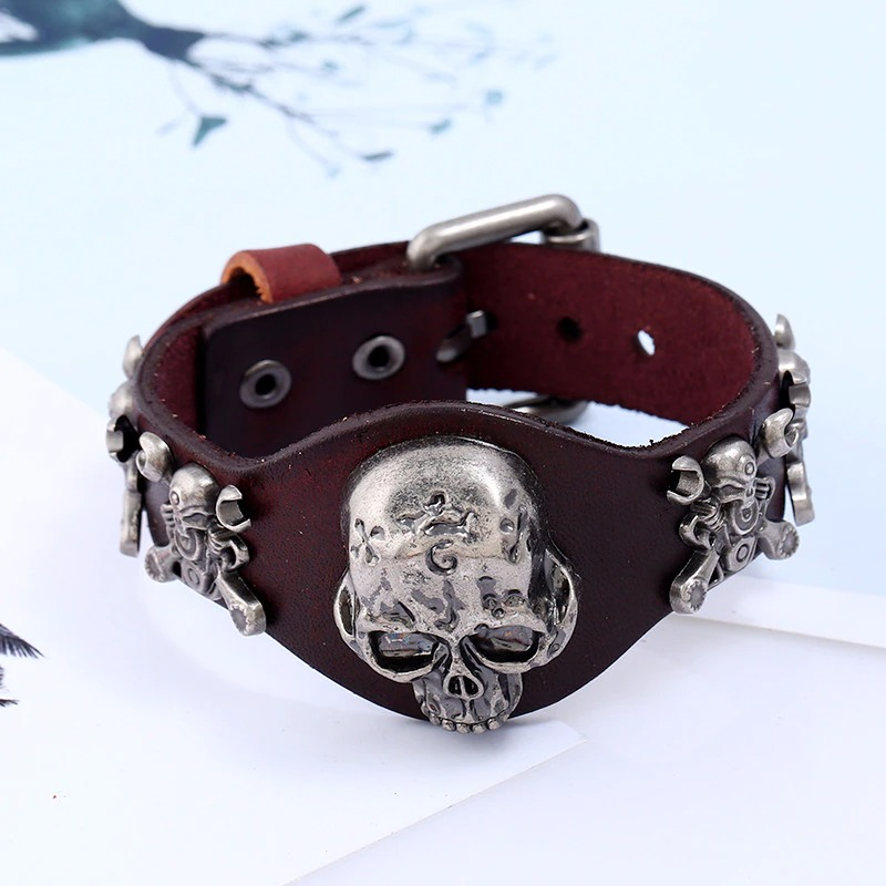 Gothic genuine leather bracelet with silver skull buckle, unisex accessory for edgy fashion lovers.