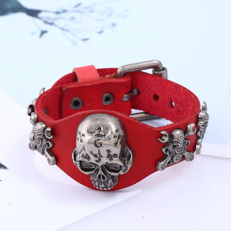 Gothic red leather bracelet for men and women featuring silver skull decorations, perfect unisex accessory.