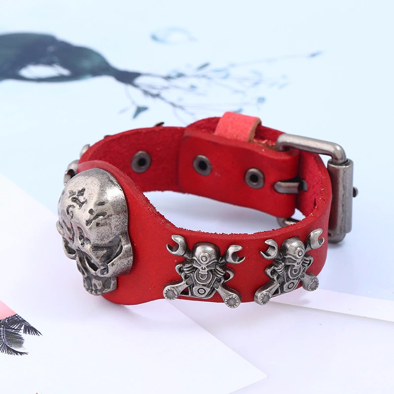 Gothic unisex red leather bracelet with silver skull and clown details, perfect for edgy fashion lovers.