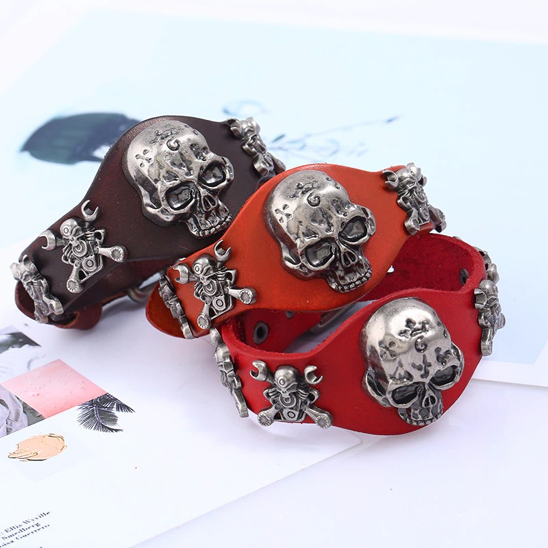 Gothic genuine leather belt buckle bracelets for unisex, featuring silver skulls, available in brown and red.